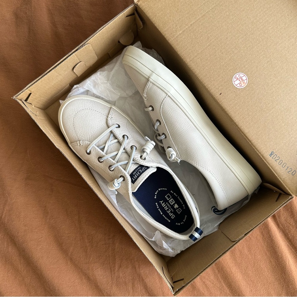 Sperry womens Off-White Leather Boat Shoes with Navy Accents